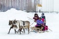 Local aborigines - Khanty, ride children on a reindeer sleigh of three deer, sleigh, winter, Ã¢â¬ÅSeeing off winterÃ¢â¬Â festival Royalty Free Stock Photo